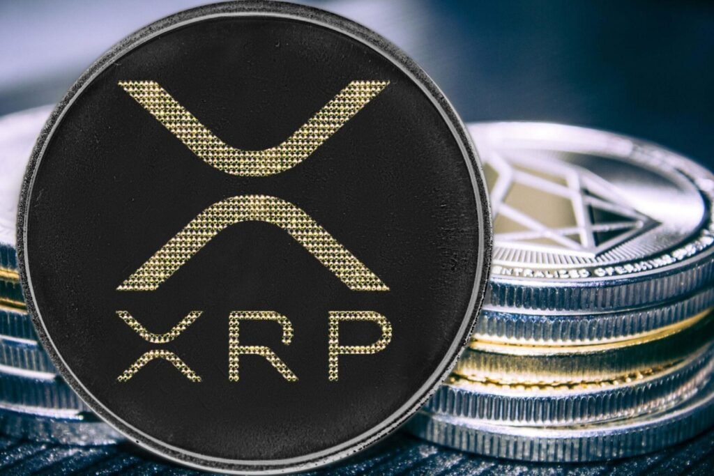 Physical XRP coins stacked on reflective surface